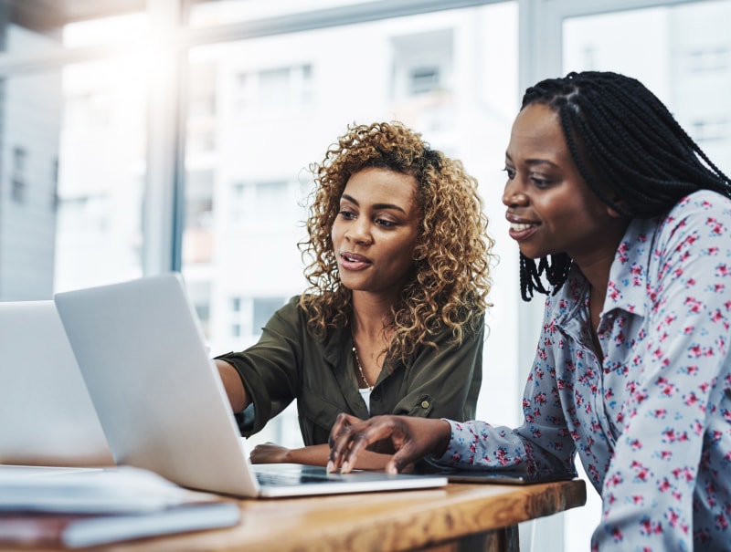 business women meeting with laptops