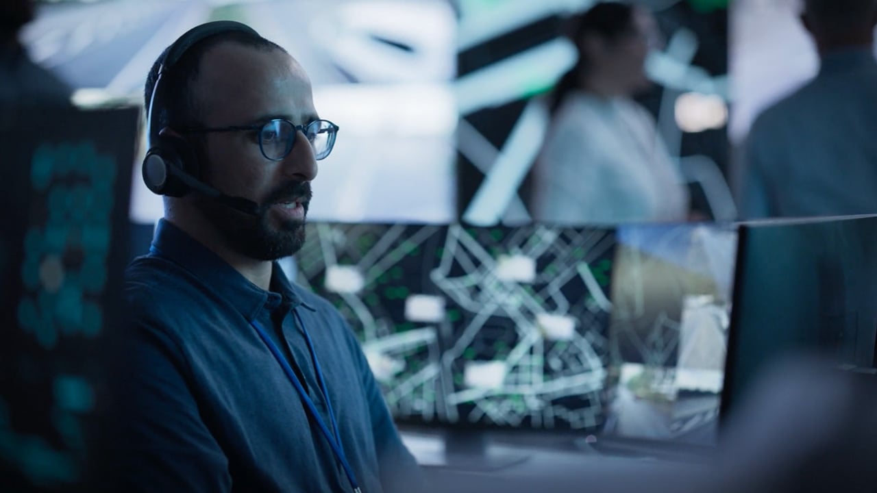 Man at desk working on Cisco FSO’s Platform