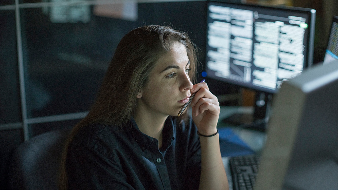 IT professional reviewing Intersight dashboards in computer lab